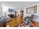 Spacious living room with hardwood floors, a large TV, and comfortable seating at 306 Boger N Blvd, Lakeland, FL 33803