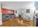 Living room with hardwood floors, gray couches, and a red brick accent wall at 306 Boger N Blvd, Lakeland, FL 33803