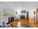 Living room with hardwood floors, a fireplace, large windows, and a grandfather clock at 306 Boger N Blvd, Lakeland, FL 33803