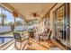 Enjoy this screened lanai with comfortable seating and pool views at 306 Boger N Blvd, Lakeland, FL 33803