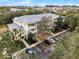 Aerial perspective of a multi-story building with parking and surrounding trees at 312 Lucaya Loop # B5/U312, Davenport, FL 33897