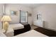 Bright bedroom with two twin beds, dresser, and window at 312 Lucaya Loop # B5/U312, Davenport, FL 33897