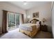 Bedroom with a queen bed and access to balcony at 312 Lucaya Loop # B5/U312, Davenport, FL 33897