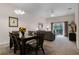 Combined dining and living area with view of balcony at 312 Lucaya Loop # B5/U312, Davenport, FL 33897