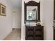 Condo entryway with a mirror and wicker cabinet at 312 Lucaya Loop # B5/U312, Davenport, FL 33897