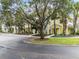 Building exterior showcasing a charming yellow building with landscaping at 312 Lucaya Loop # B5/U312, Davenport, FL 33897