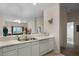 Kitchen with white cabinets, stainless steel appliances, and views to living room at 312 Lucaya Loop # B5/U312, Davenport, FL 33897