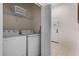 Laundry room with washer, dryer, and shelving at 312 Lucaya Loop # B5/U312, Davenport, FL 33897