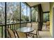 Screened balcony with table and chairs at 312 Lucaya Loop # B5/U312, Davenport, FL 33897