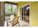 Screened balcony with patio furniture and sliding door access at 312 Lucaya Loop # B5/U312, Davenport, FL 33897