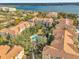 Aerial view of community with lake and pool at 3326 Robert Trent Jones Dr # 10102, Orlando, FL 32835