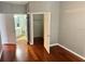 Bedroom with hardwood floors, a closet, and a view of the bathroom at 3326 Robert Trent Jones Dr # 10102, Orlando, FL 32835