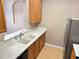 Kitchen with wood cabinets, double sink, and stainless steel refrigerator at 3326 Robert Trent Jones Dr # 10102, Orlando, FL 32835