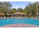 Resort-style community pool with relaxing lounge chairs at 3326 Robert Trent Jones Dr # 10102, Orlando, FL 32835