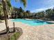 Community pool with ample deck space at 3326 Robert Trent Jones Dr # 10102, Orlando, FL 32835