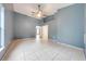 Blue bedroom with tile floors and access to bathroom at 3394 Cypress Point Cir, Saint Cloud, FL 34772