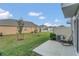 Small backyard with patio and rocking chair at 4078 Malawi Trl, Saint Cloud, FL 34772