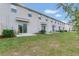 Community backyard with multiple patios and green lawn at 4078 Malawi Trl, Saint Cloud, FL 34772