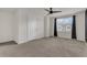 Spacious bedroom with ceiling fan and neutral carpeting at 4078 Malawi Trl, Saint Cloud, FL 34772