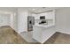 Modern kitchen with stainless steel appliances and an island at 4078 Malawi Trl, Saint Cloud, FL 34772