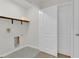 Laundry room with built-in shelving and a door at 4078 Malawi Trl, Saint Cloud, FL 34772