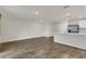Open concept living room with wood-look flooring at 4078 Malawi Trl, Saint Cloud, FL 34772