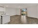 Open living room with wood-look floors and view to backyard at 4078 Malawi Trl, Saint Cloud, FL 34772