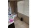 Second bathroom with a shower/tub combo and large window at 4235 Edgewater Dr, Orlando, FL 32804