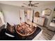 Cozy bedroom featuring soft lighting, ceiling fan, and wood-look floors at 4858 Stone Acres Cir, St Cloud, FL 34771