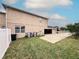 Rear of house showcasing a fenced yard, patio, and air conditioning units at 4858 Stone Acres Cir, St Cloud, FL 34771