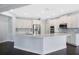Bright kitchen with white cabinetry, stainless steel appliances, and large island at 4858 Stone Acres Cir, St Cloud, FL 34771