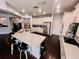 Modern kitchen with stainless steel appliances, a central island with seating, and sleek finishes at 4858 Stone Acres Cir, St Cloud, FL 34771