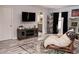 Cozy living room with modern decor, stylish rug and entertainment center at 4858 Stone Acres Cir, St Cloud, FL 34771