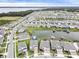 Aerial view of lakefront homes in a quiet residential area at 5052 Center Ct, St Cloud, FL 34772