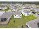 Aerial view of a community with houses, roads, and lush green areas at 5052 Center Ct, St Cloud, FL 34772