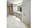 Double vanity bathroom with light gray cabinets at 5052 Center Ct, St Cloud, FL 34772