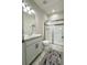 Clean bathroom with white vanity, tiled floors, and a glass shower at 5052 Center Ct, St Cloud, FL 34772