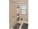 Simple bathroom with shower/tub combo and grey accents at 5052 Center Ct, St Cloud, FL 34772