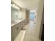 Double vanity bathroom with walk-in shower at 5052 Center Ct, St Cloud, FL 34772