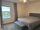 Spacious bedroom with lake view and neutral decor at 5052 Center Ct, St Cloud, FL 34772