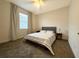 Comfortable bedroom with carpeted floors and neutral color palette at 5052 Center Ct, St Cloud, FL 34772