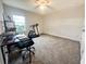 Bright bedroom with treadmill and workspace at 5052 Center Ct, St Cloud, FL 34772
