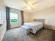Bright bedroom featuring a comfortable bed and lake view at 5052 Center Ct, St Cloud, FL 34772