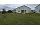 Two-story house with backyard, covered patio, and grassy area at 5052 Center Ct, St Cloud, FL 34772