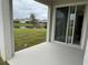 Covered patio offers a serene view of the pond and neighboring houses at 5052 Center Ct, St Cloud, FL 34772