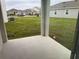 Covered patio with view of a residential neighborhood at 5052 Center Ct, St Cloud, FL 34772