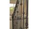 Elegant staircase with black metal balusters at 5052 Center Ct, St Cloud, FL 34772