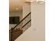 Modern staircase with dark metal balusters and white walls at 5052 Center Ct, St Cloud, FL 34772