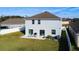 Home features a fenced backyard with patio and grassy area at 524 Sardinia Cir, Davenport, FL 33837