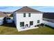 Home features a fenced backyard with patio and grassy area at 524 Sardinia Cir, Davenport, FL 33837